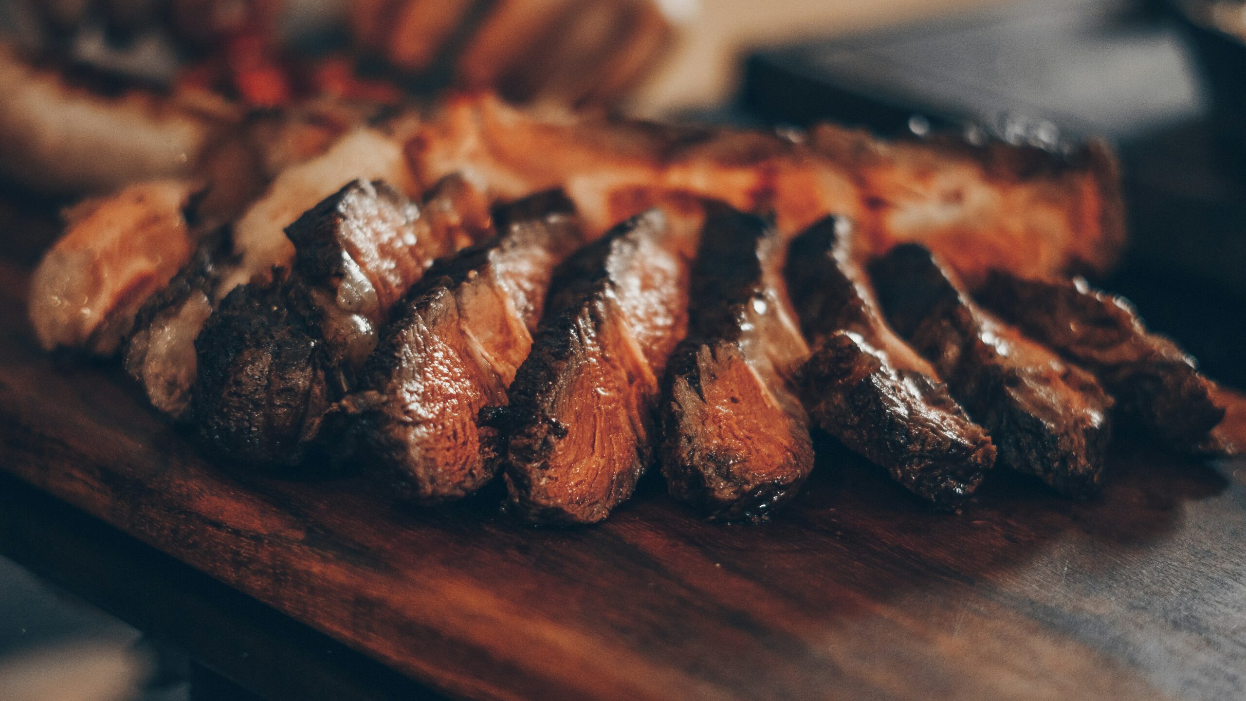 Detail image of carved steak dish.