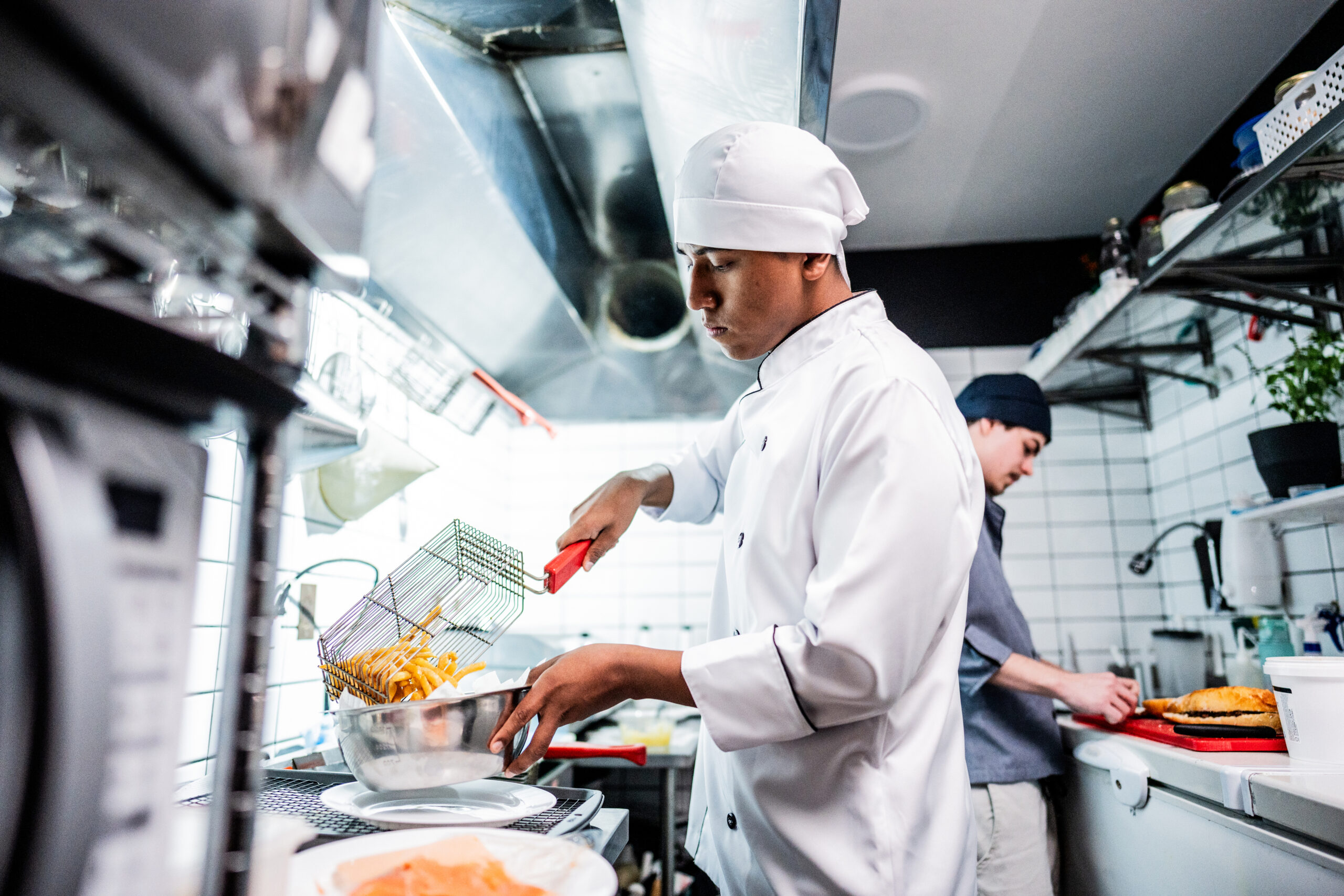 Hero image of Restaurant staff working in a commercial kitchen