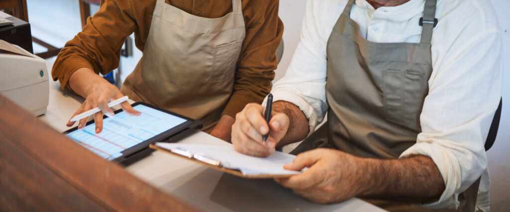 Hero Image of GM and Chef Reviewing Data for the Restaurant Business